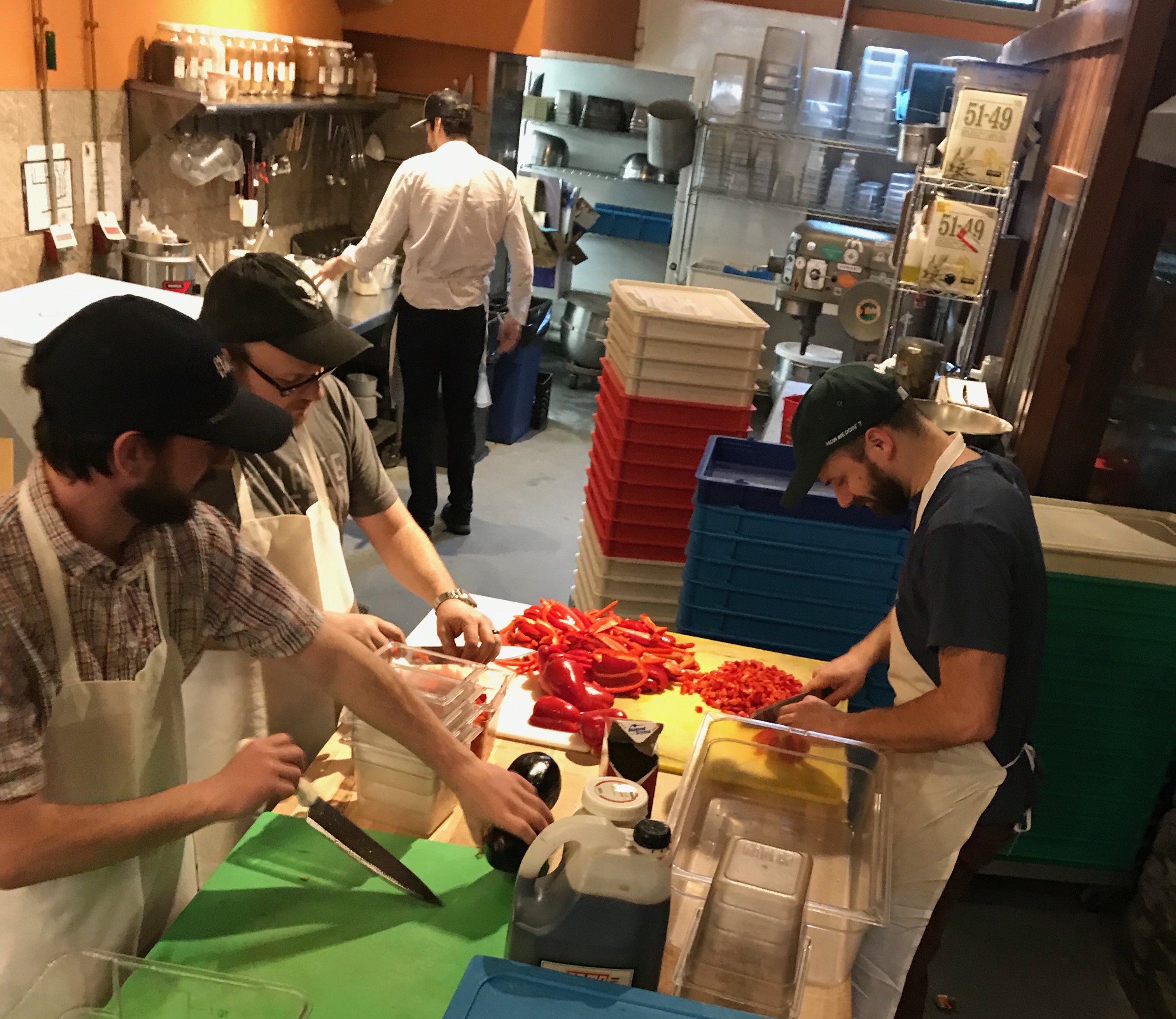 Flatbread employees prepping food