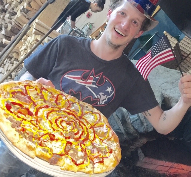 man with memorial day themed pizza